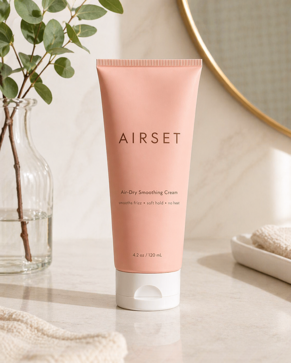 AIRSET Air-Dry Smoothing Cream standing on a bright vanity with soft towel and greenery